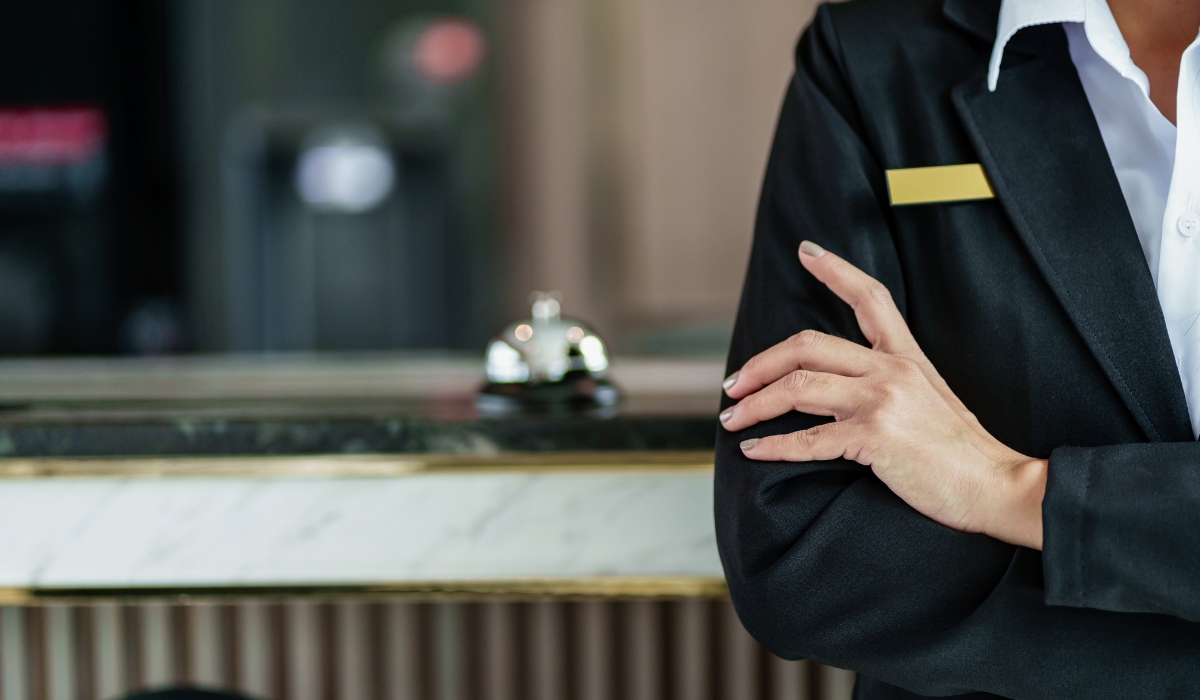 Hotel guest using AI chatbot for customer service on smartphone